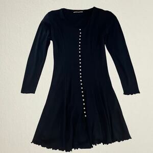 Black pearl button fit and flare dress, classic Carolyn Bessette-Kennedy vibes